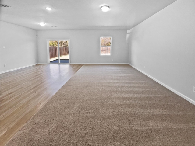 empty room featuring wood-type flooring