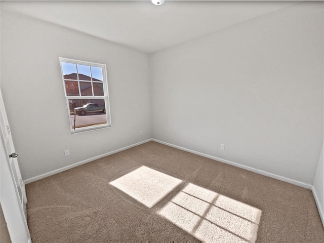 spare room with carpet floors