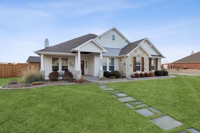 craftsman house with a front lawn