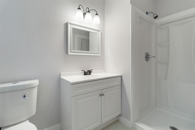 bathroom with vanity, walk in shower, and toilet