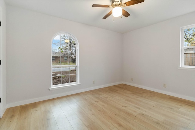 empty room featuring ceiling fan and light hardwood / wood-style flooring