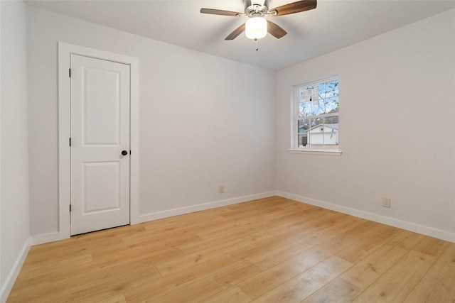 empty room featuring light hardwood / wood-style floors and ceiling fan