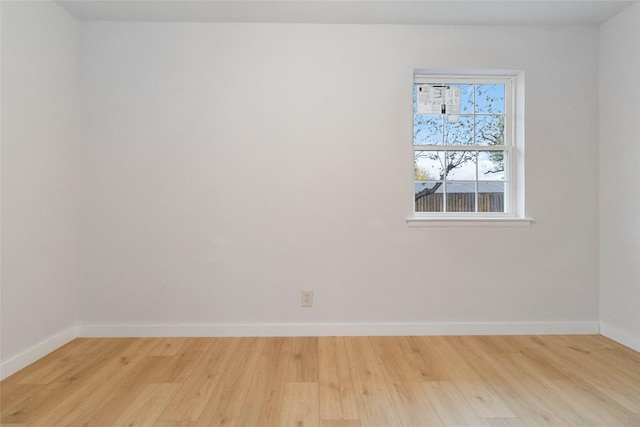 unfurnished room with light hardwood / wood-style flooring