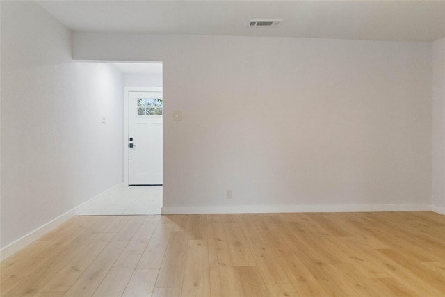 unfurnished room featuring light hardwood / wood-style floors