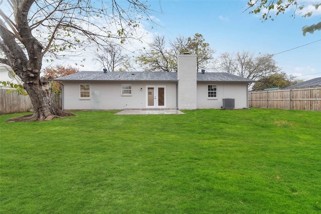 back of house featuring central AC, a yard, french doors, and a patio