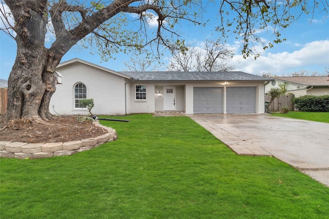 ranch-style house featuring a front yard and a garage