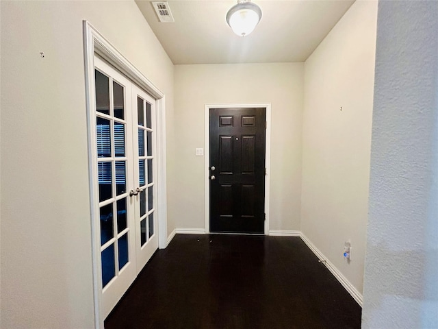 entryway featuring french doors