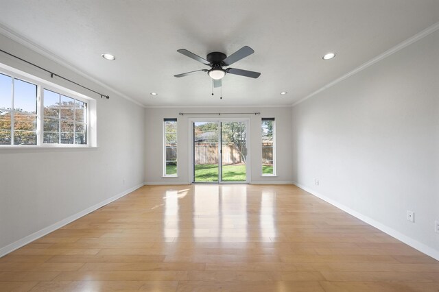 unfurnished room with ceiling fan, a healthy amount of sunlight, light hardwood / wood-style floors, and ornamental molding