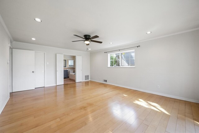 unfurnished bedroom featuring light hardwood / wood-style floors, ceiling fan, and ornamental molding