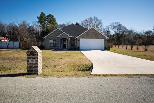 ranch-style home featuring a front lawn and a garage