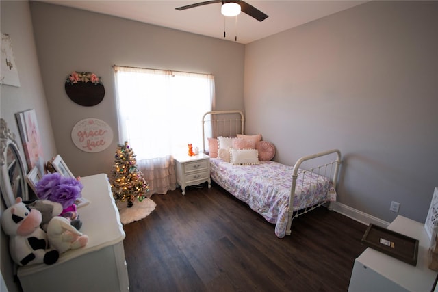 bedroom with ceiling fan and dark wood-type flooring