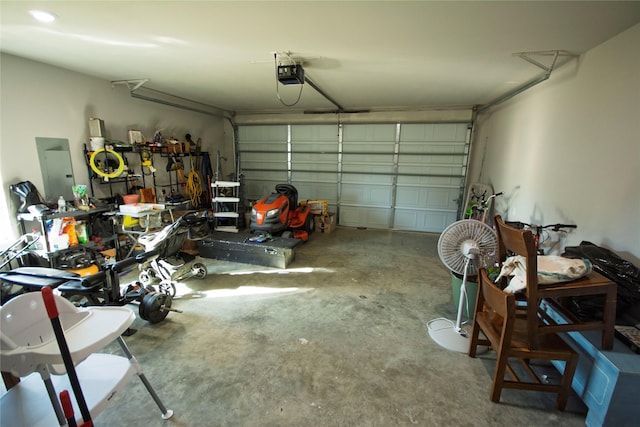 garage featuring a garage door opener and electric panel