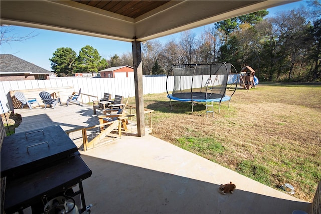 view of patio / terrace featuring a playground and a trampoline