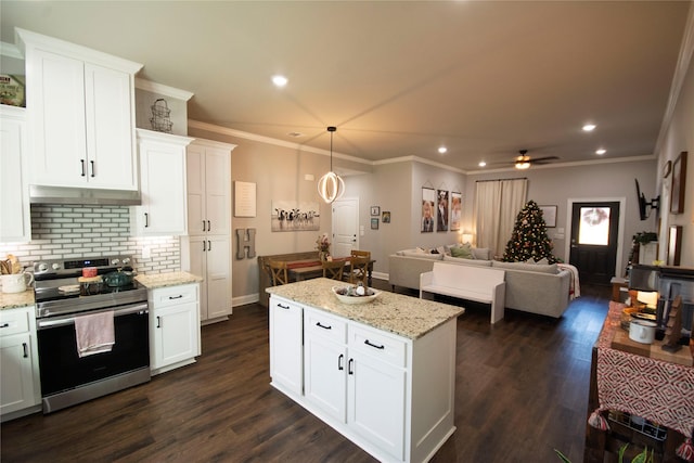 kitchen featuring stainless steel electric range oven, white cabinets, and ceiling fan