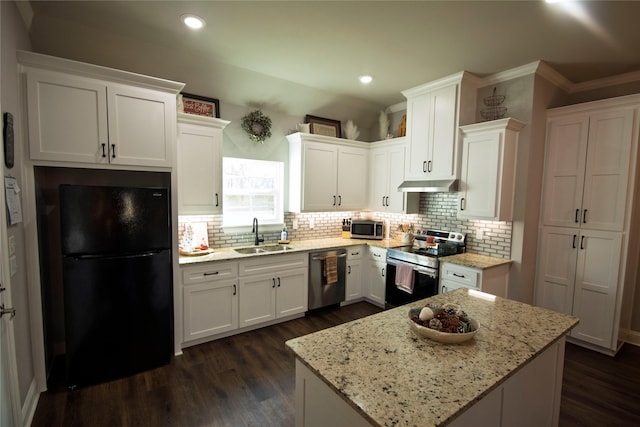 kitchen featuring appliances with stainless steel finishes, dark hardwood / wood-style floors, white cabinetry, and sink