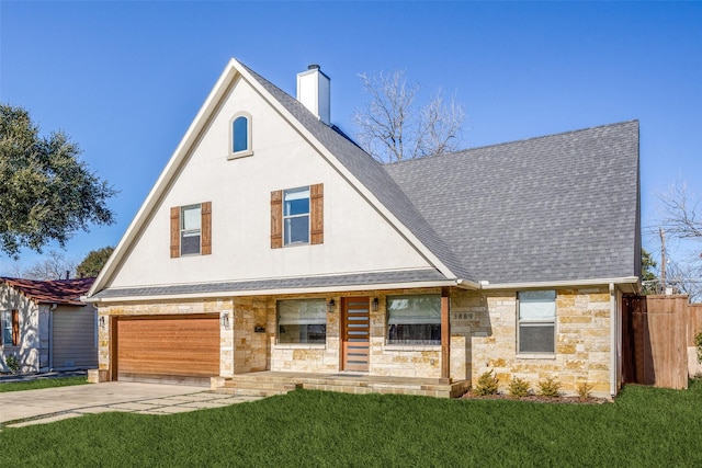 view of front of house with a porch, a garage, and a front yard