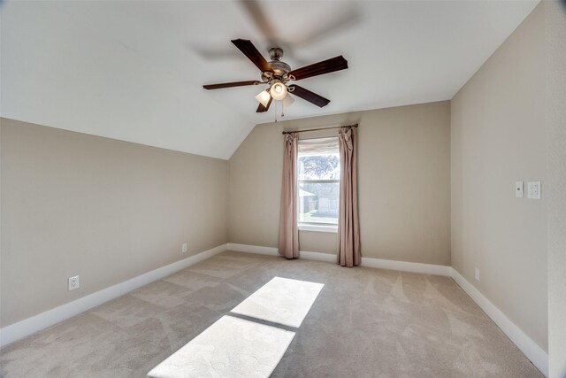 bonus room featuring ceiling fan, light carpet, and vaulted ceiling