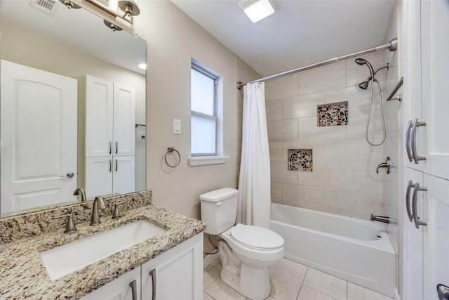 full bathroom with tile patterned flooring, vanity, toilet, and shower / tub combo