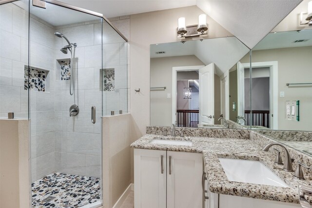 bathroom with vanity and an enclosed shower