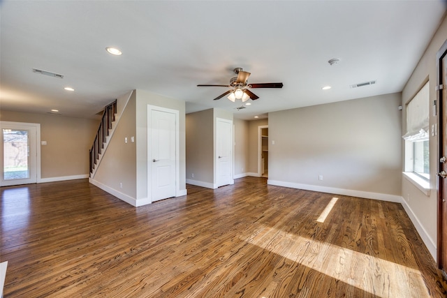 unfurnished room with ceiling fan and dark wood-type flooring