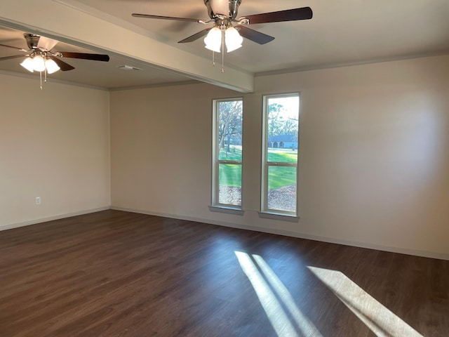 empty room with beam ceiling, dark wood-type flooring, and ornamental molding