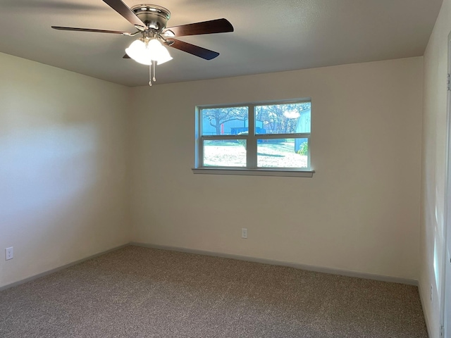 empty room with carpet floors and ceiling fan