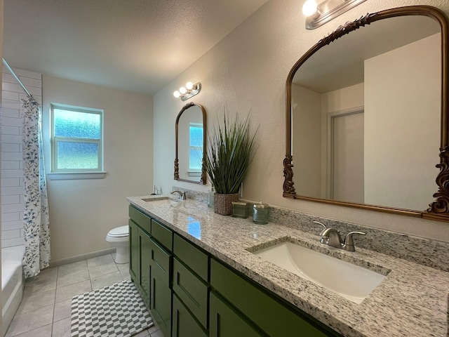 bathroom featuring vanity, tile patterned floors, and toilet