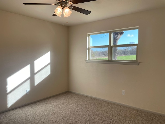 carpeted empty room with ceiling fan