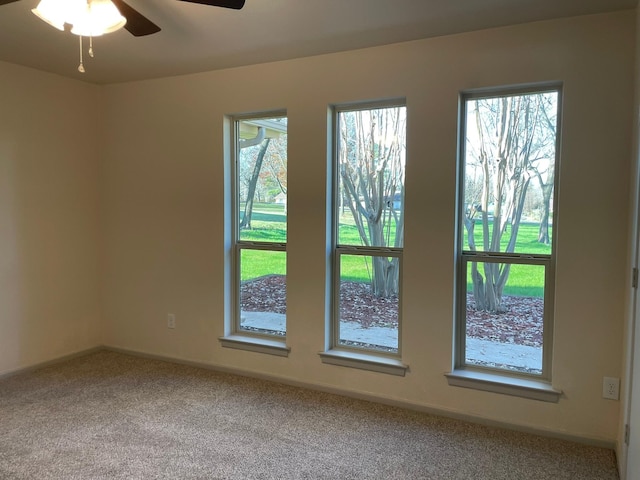 empty room with carpet floors and ceiling fan