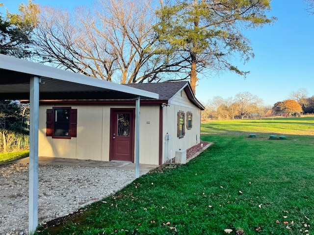 view of side of home featuring a lawn