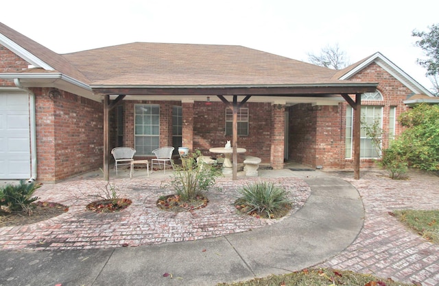 view of patio featuring a garage