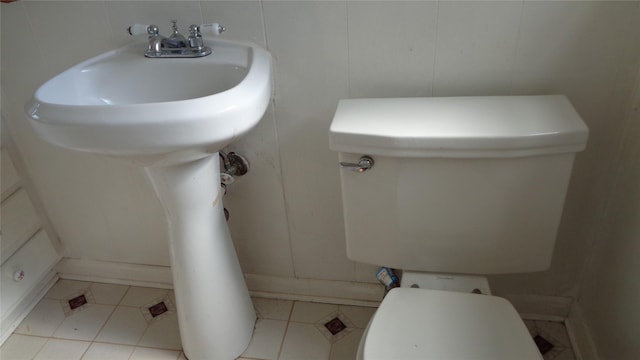 bathroom featuring tile patterned floors and toilet