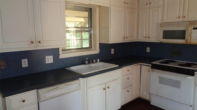 kitchen with white cabinets, white appliances, sink, and tasteful backsplash