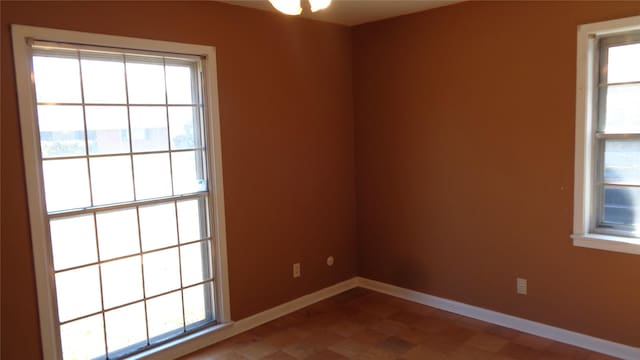 spare room with a wealth of natural light