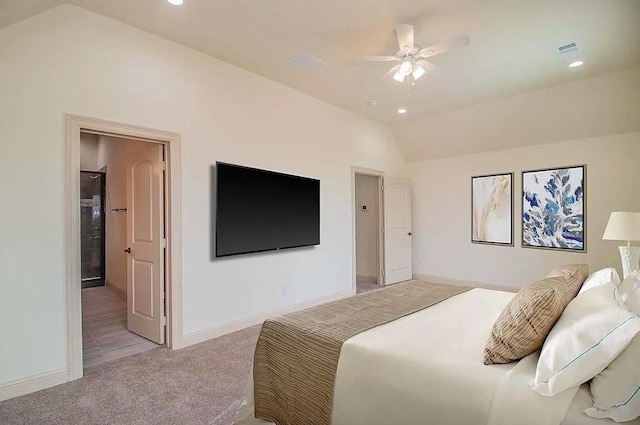 bedroom with light colored carpet, ceiling fan, and lofted ceiling