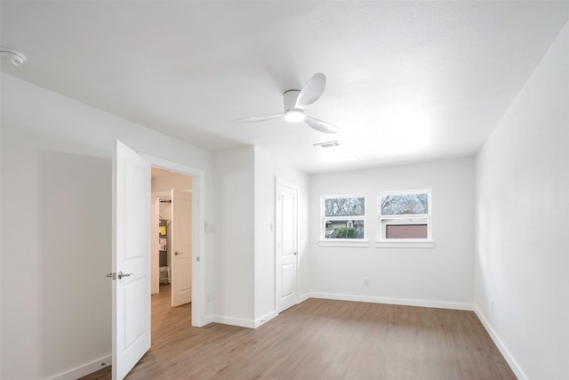 unfurnished bedroom with ceiling fan, a closet, and light hardwood / wood-style floors