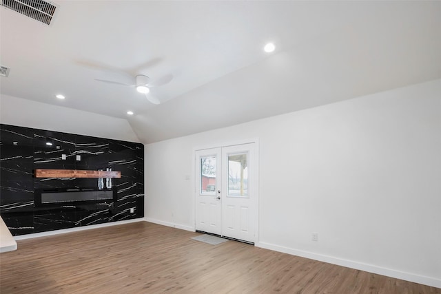 interior space featuring hardwood / wood-style floors, ceiling fan, and lofted ceiling