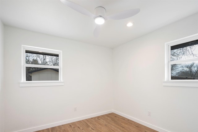 unfurnished room with wood-type flooring and ceiling fan