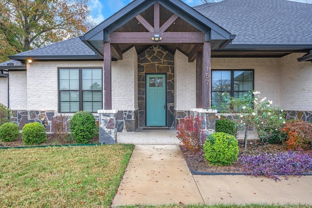 doorway to property featuring a yard