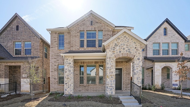 view of front of property with stone siding and brick siding