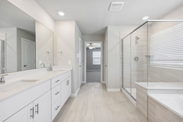 bathroom featuring separate shower and tub, ceiling fan, and vanity