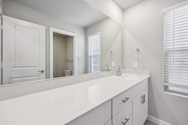 bathroom with vanity and toilet