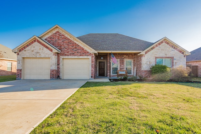 view of front of house with a garage and a front lawn