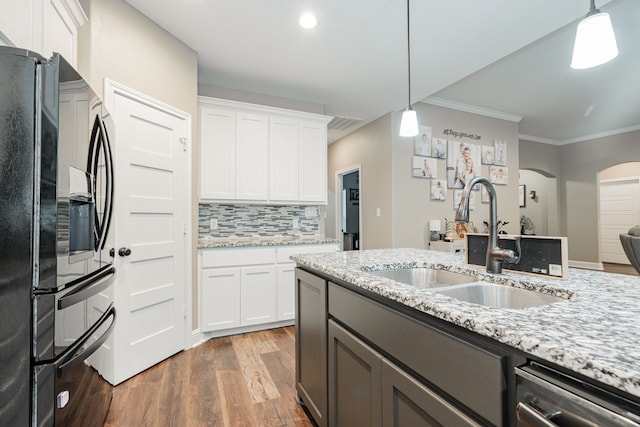 kitchen featuring black refrigerator, white cabinets, and dark hardwood / wood-style floors