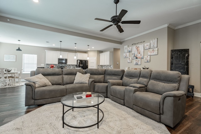 living room with ceiling fan, dark hardwood / wood-style floors, and ornamental molding