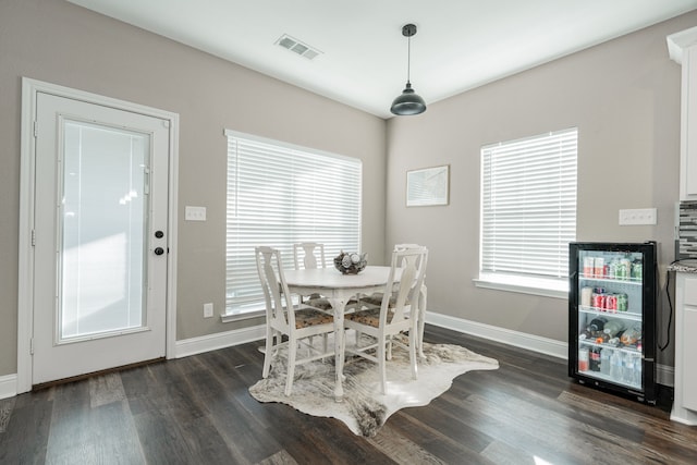 dining area with dark hardwood / wood-style floors