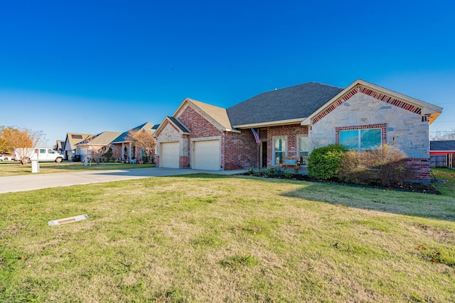 view of front of home with a front lawn and a garage