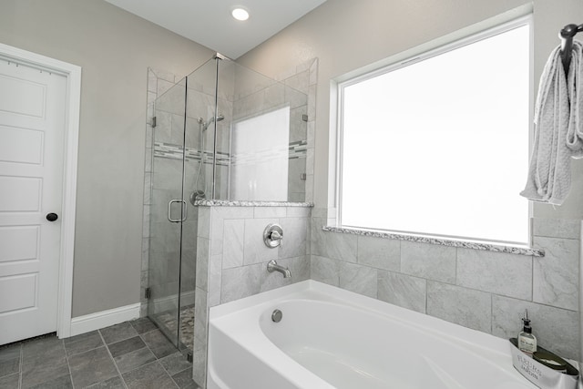 bathroom with tile patterned flooring and plus walk in shower