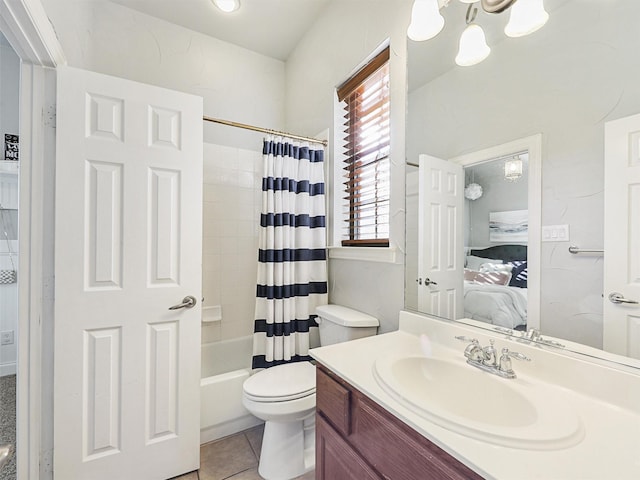 full bathroom with tile patterned floors, shower / bath combination with curtain, toilet, and vanity