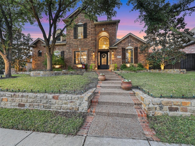 view of front of property with a lawn